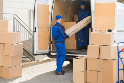 Team reviewing modern slavery compliance documents for Man With Van Catford