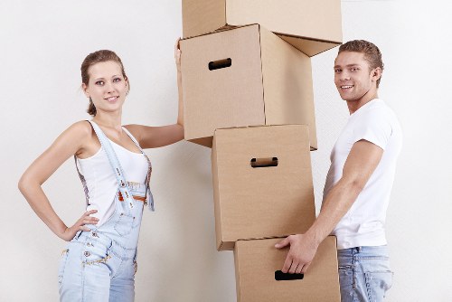Local removals truck loading furniture for a flat move in Catford
