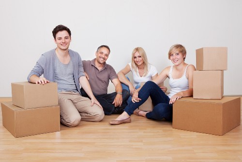 Prepared boxes and furniture ready for a moving truck in Catford
