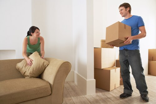 Packed office boxes and workstations ready for a business move in Catford